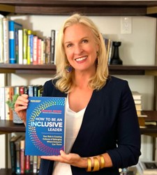 Jennifer Brown holding her new book How to Be an Inclusive Leader Second Edition